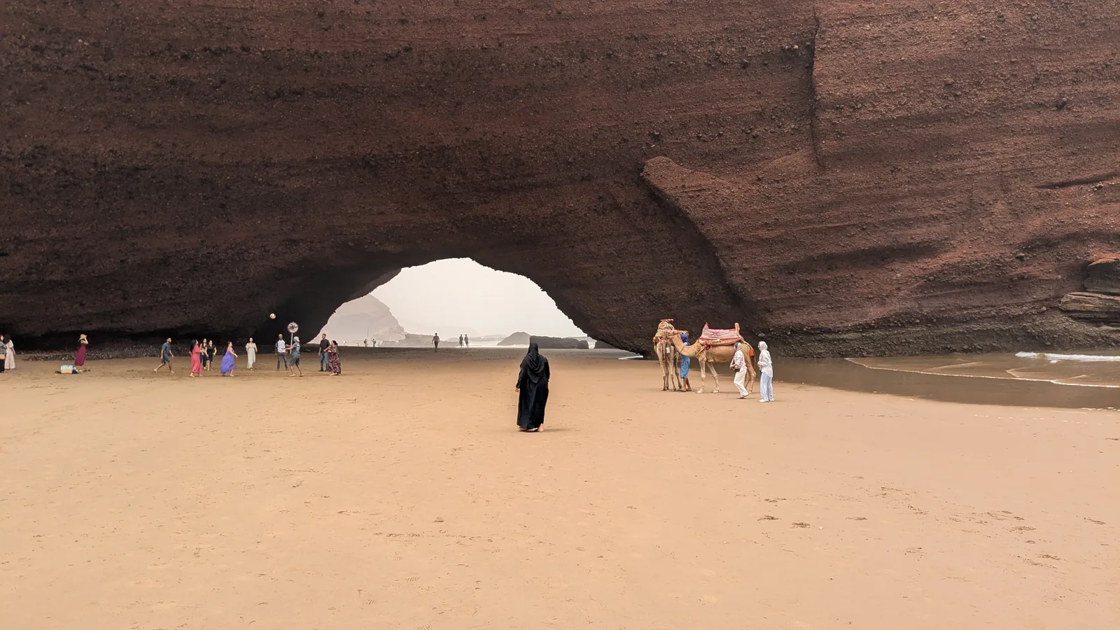 Large red-rock natural arch at Legzira beach near Sidi Ifni